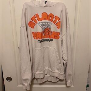 Madhappy Cream Atlanta Hawks Hoodie with Orange and Gray Graphics